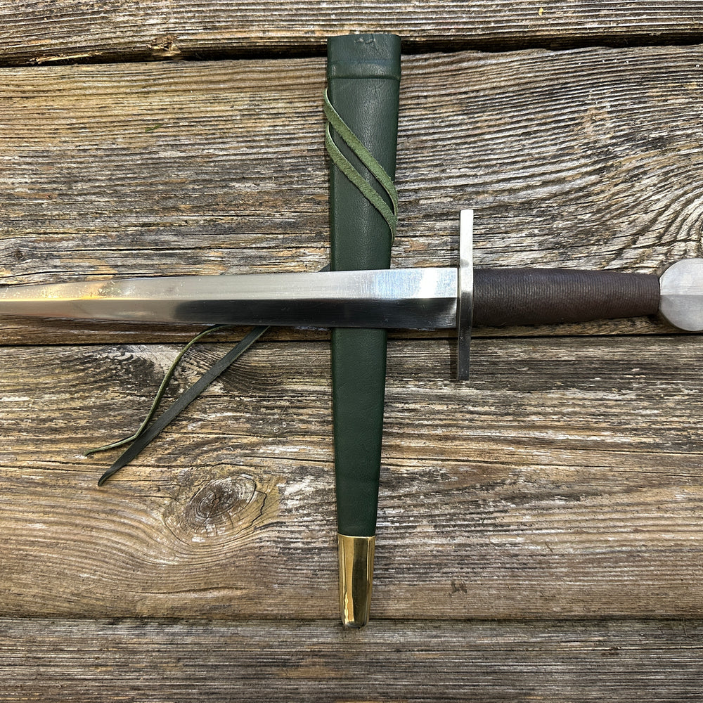 
                  
                    12-17thC Quillon Dagger with a green scabbard

                  
                
