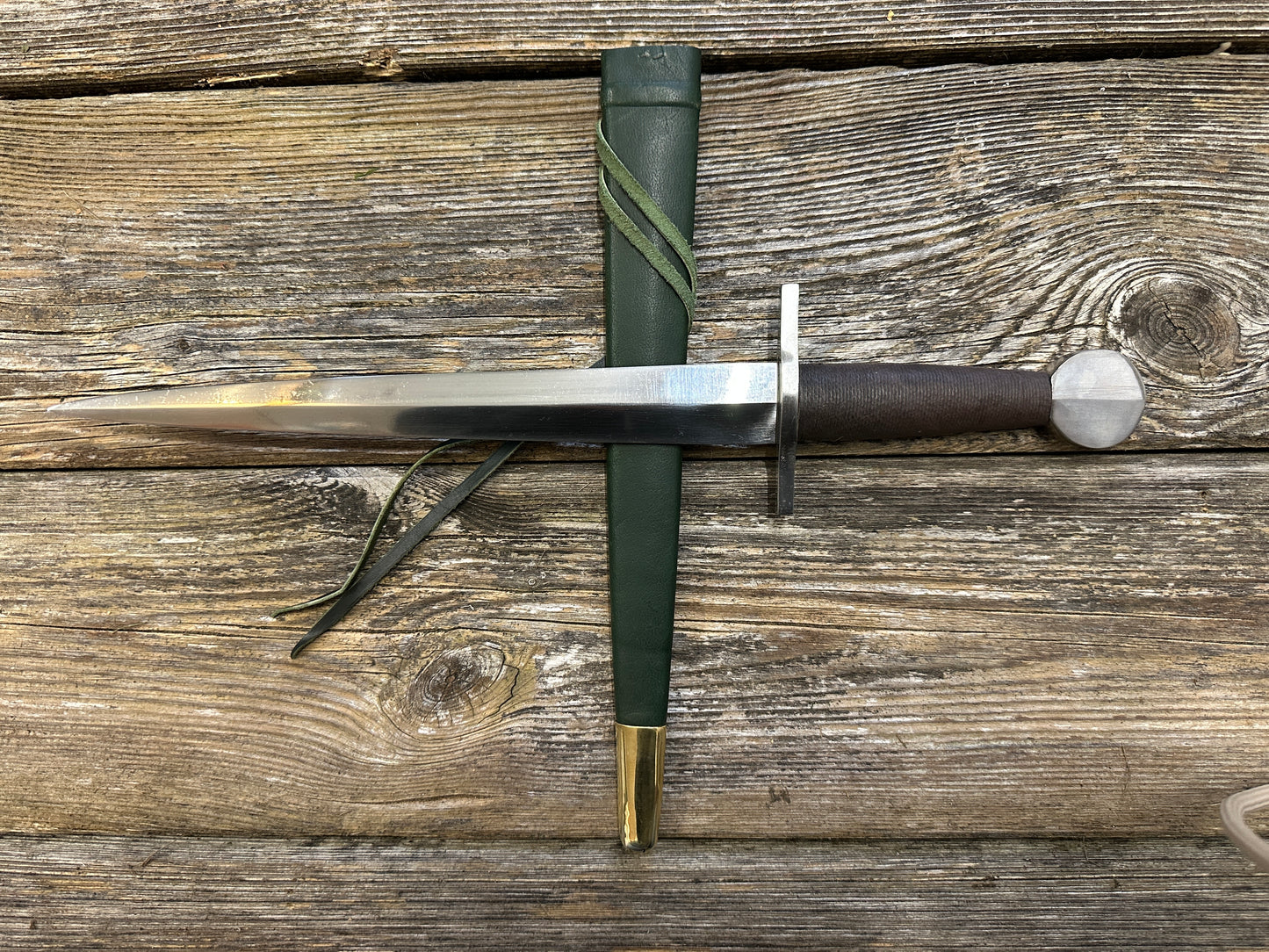 
                  
                    12-17thC Quillon Dagger with a green scabbard

                  
                