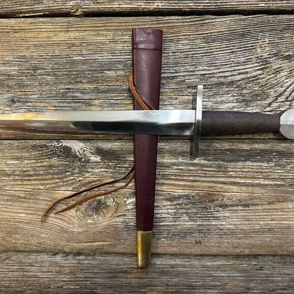 
                  
                    12-17thC Quillon Dagger with a red scabbard
                  
                