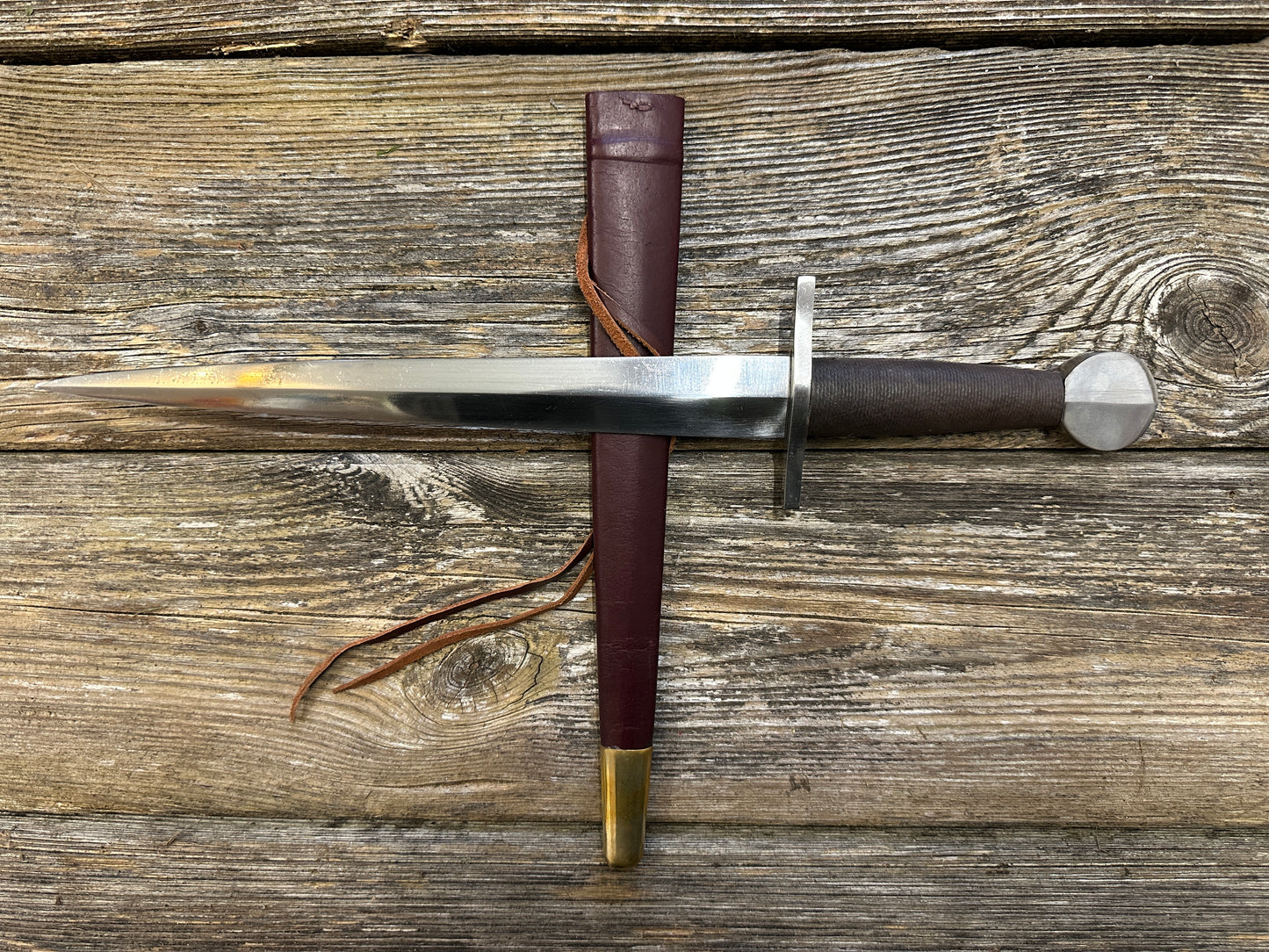 
                  
                    12-17thC Quillon Dagger with a red scabbard
                  
                