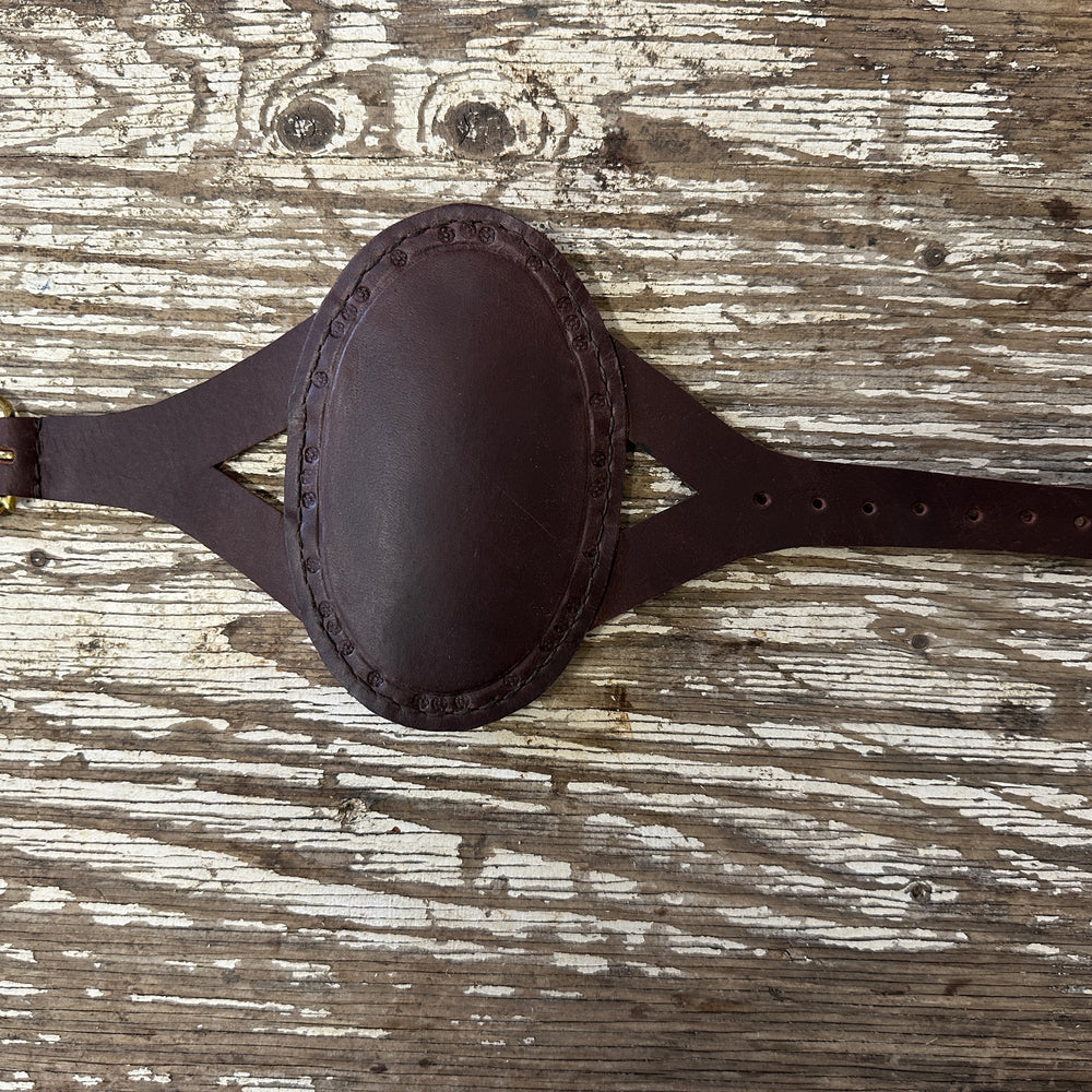 
                  
                    Oval archery bracer in brown
                  
                