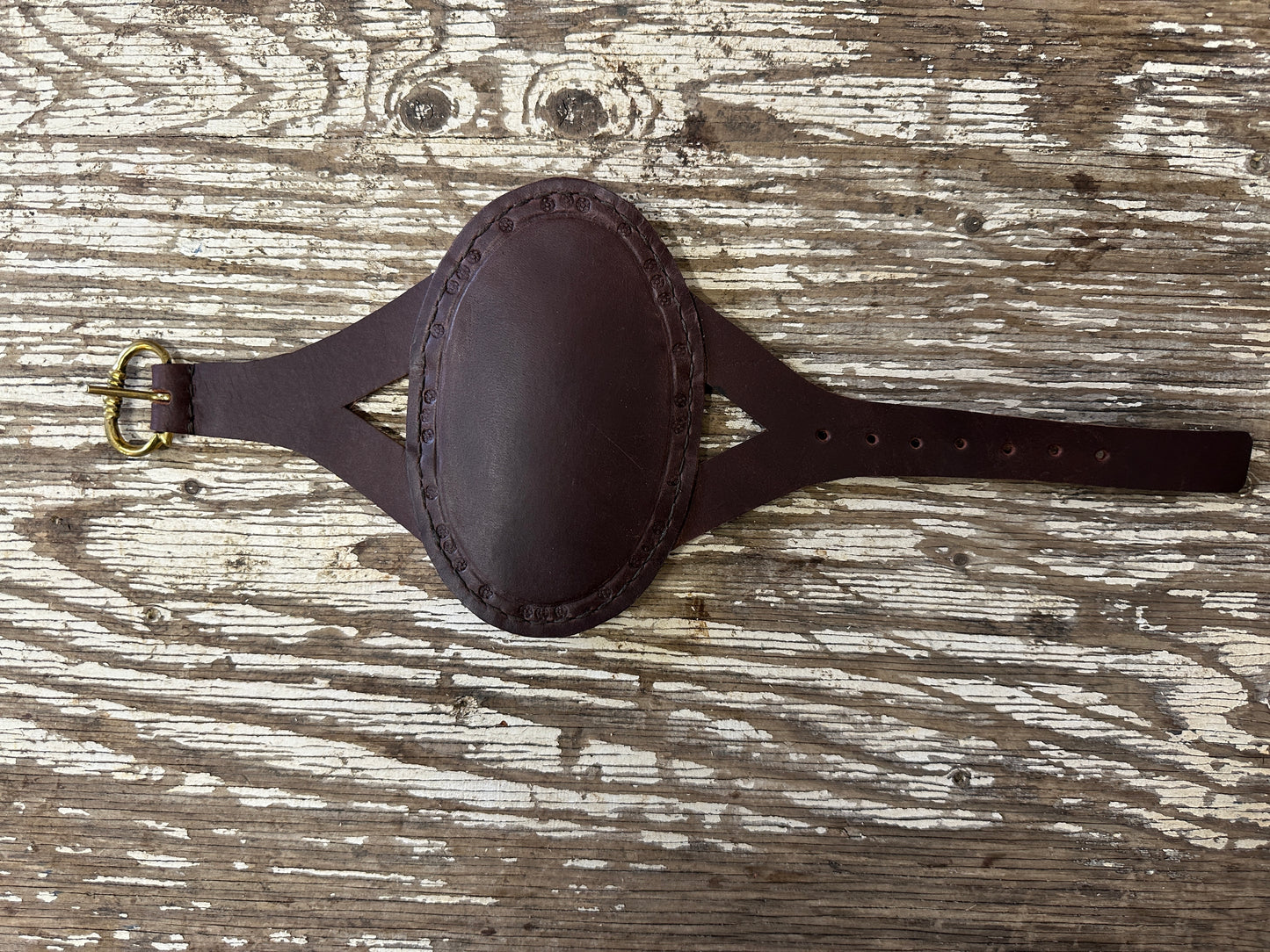 
                  
                    Oval archery bracer in brown
                  
                