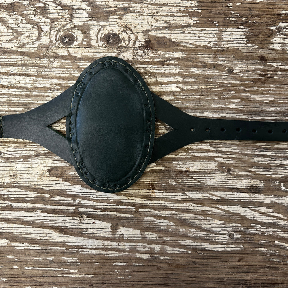 
                  
                    Oval archery bracer in green
                  
                