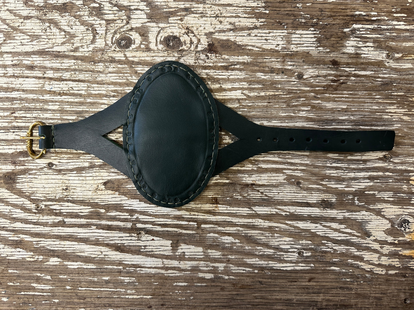 
                  
                    Oval archery bracer in green
                  
                