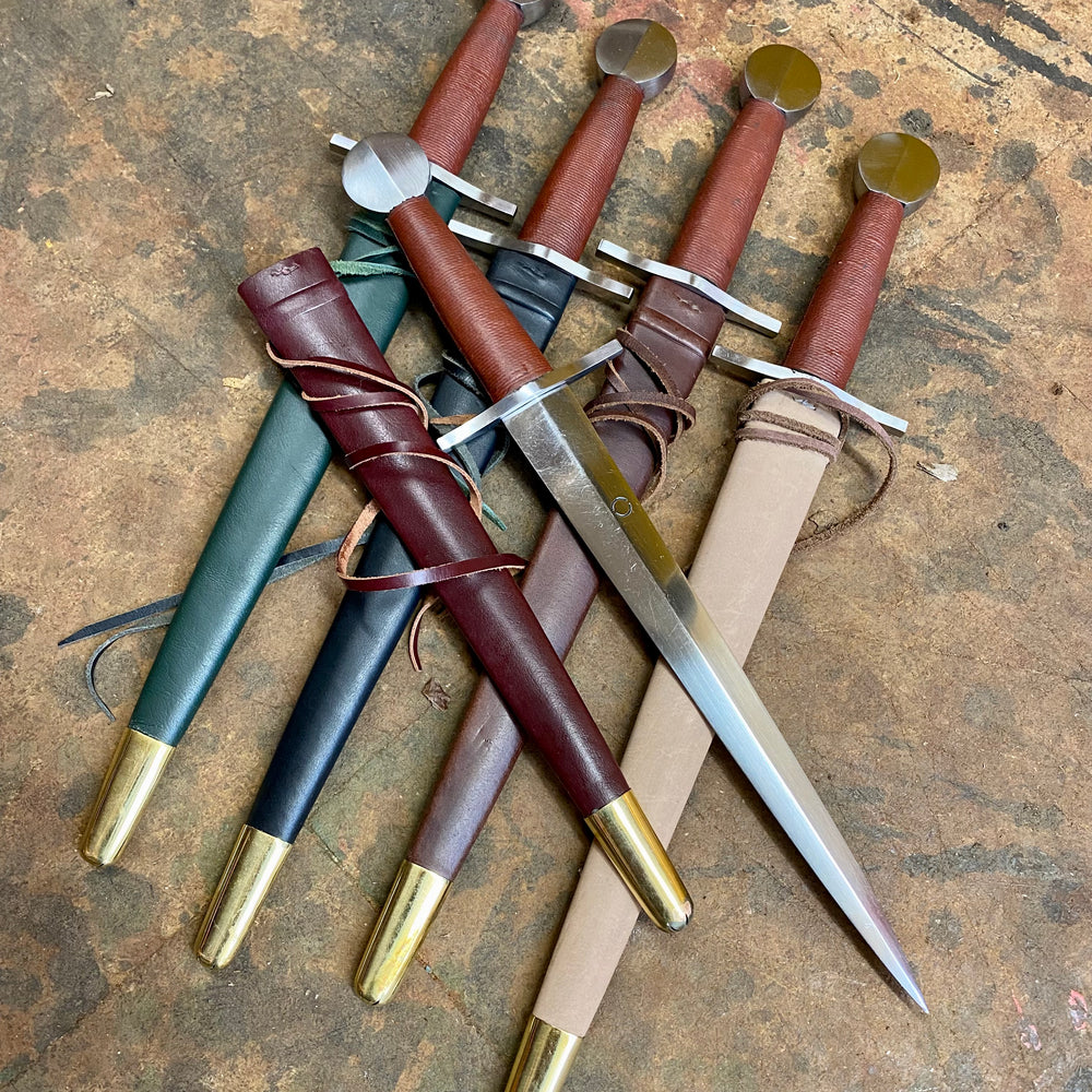 Tod Cutler Quillon daggers with red, brown, black, green and natural scabbards