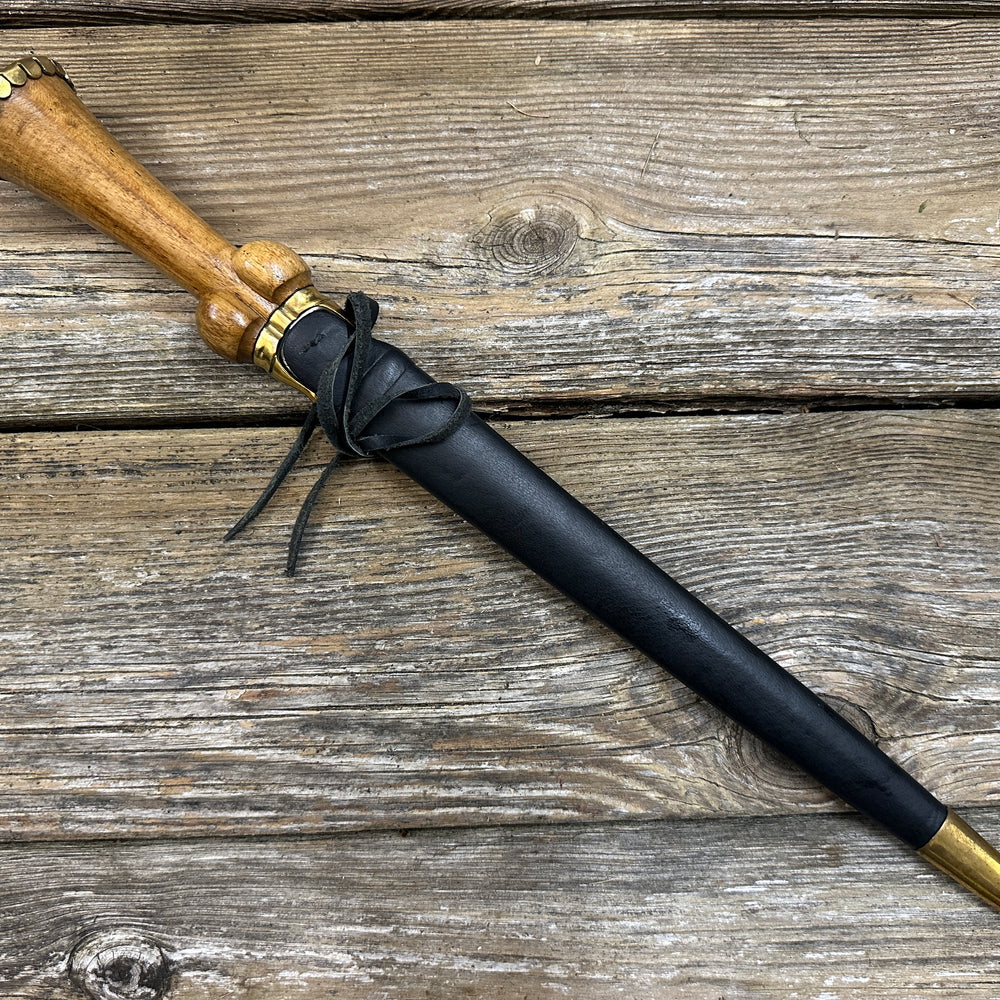 
                  
                    Mid status bollock dagger in a black scabbard
                  
                