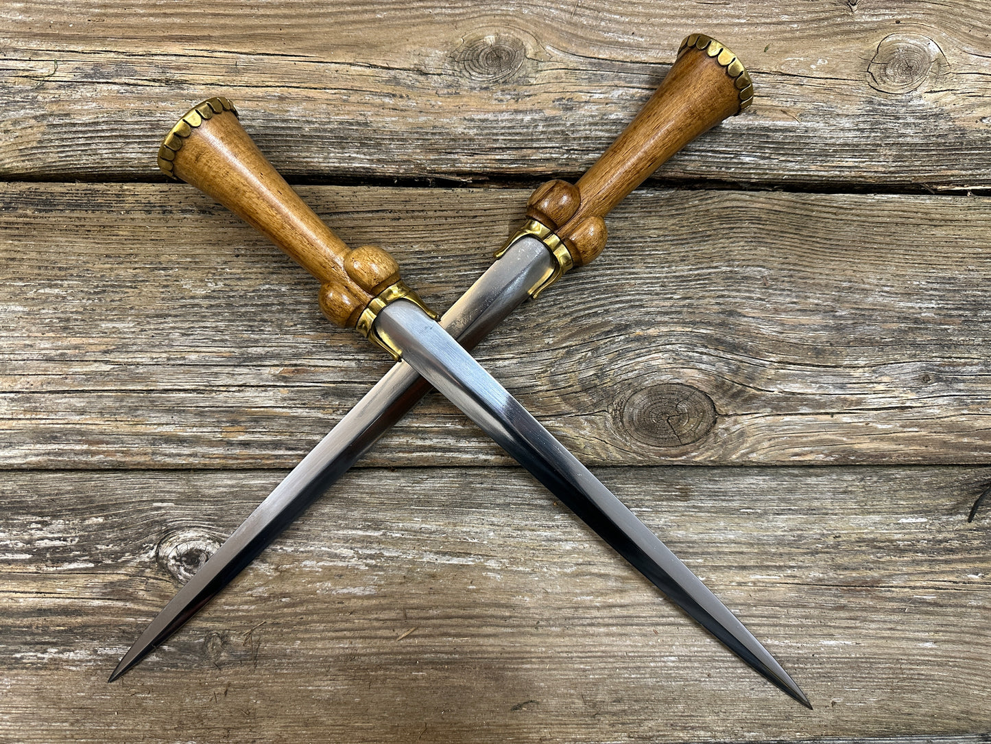 
                  
                    two Mid status bollock dagger with blades crossed.
                  
                