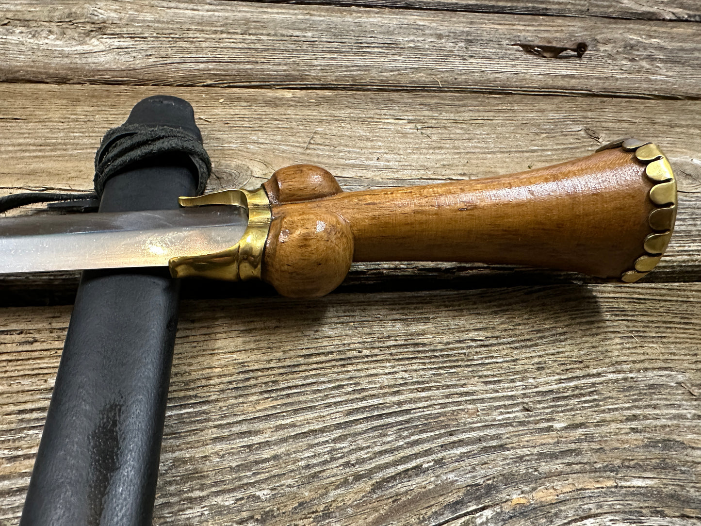 
                  
                    Mid status bollock dagger with a black scabbard
                  
                