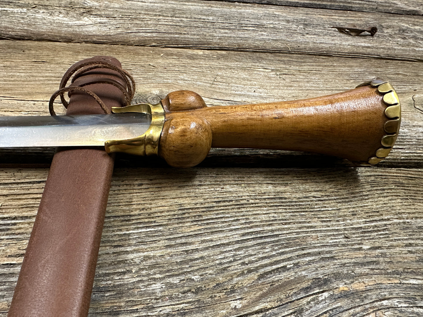 
                  
                    Mid status bollock dagger with a brown scabbard
                  
                