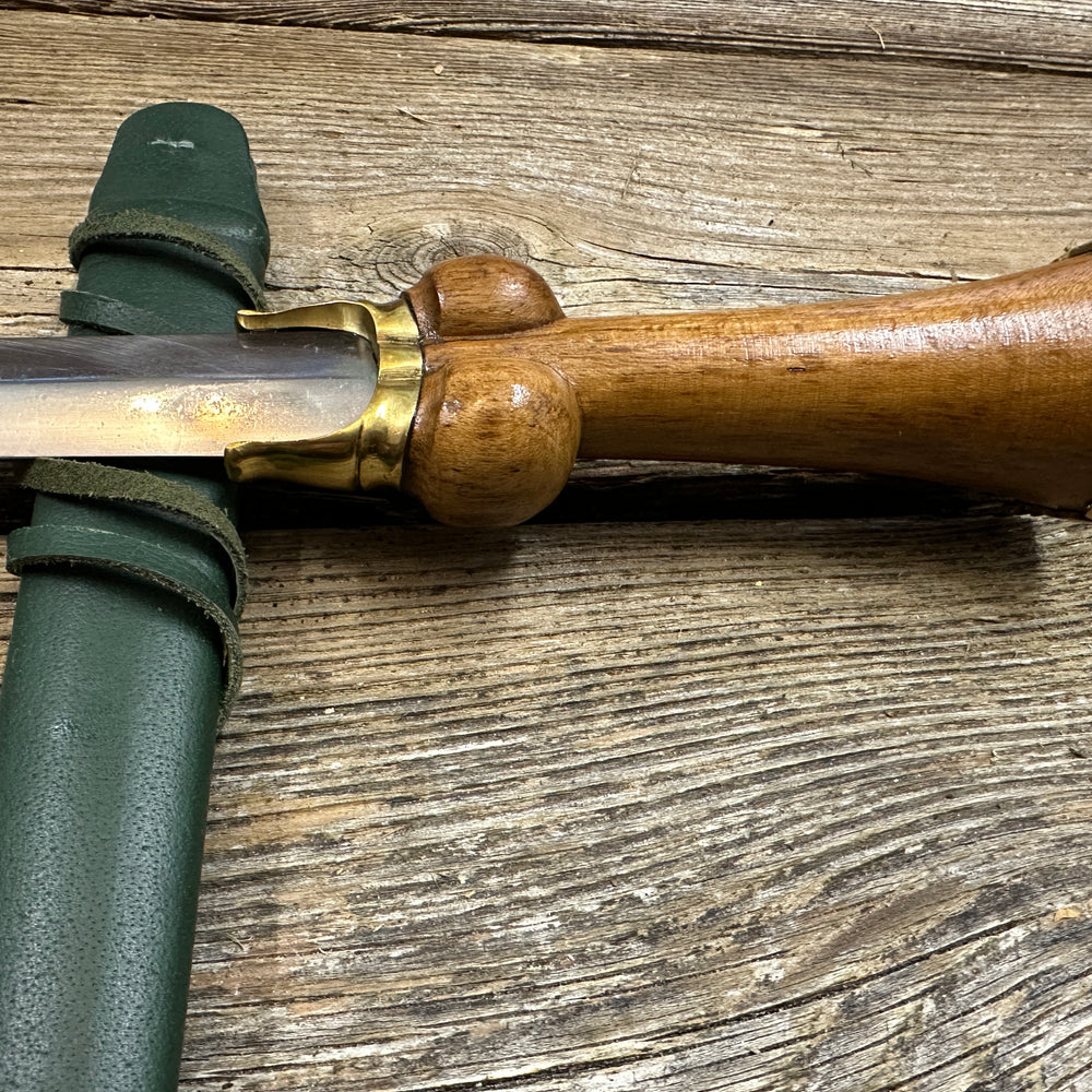 
                  
                    Mid status bollock dagger with a green scabbard
                  
                