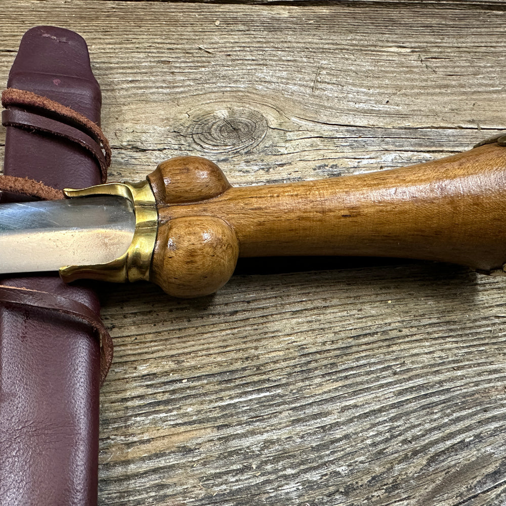 
                  
                    Mid status bollock dagger with a red scabbard
                  
                