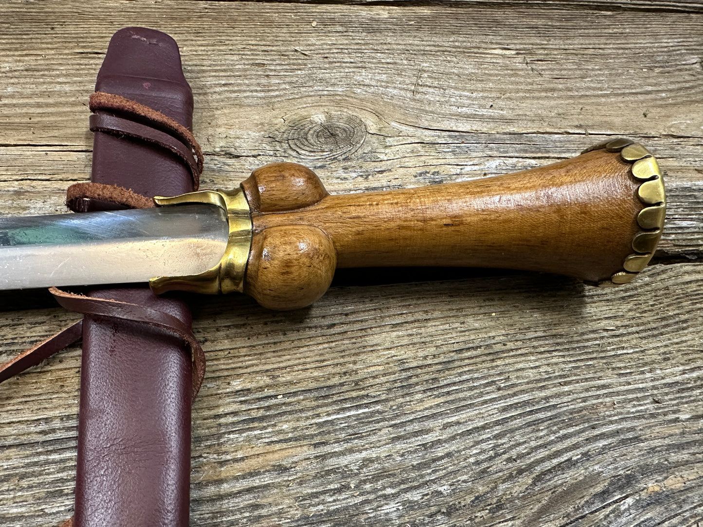 
                  
                    Mid status bollock dagger with a red scabbard
                  
                