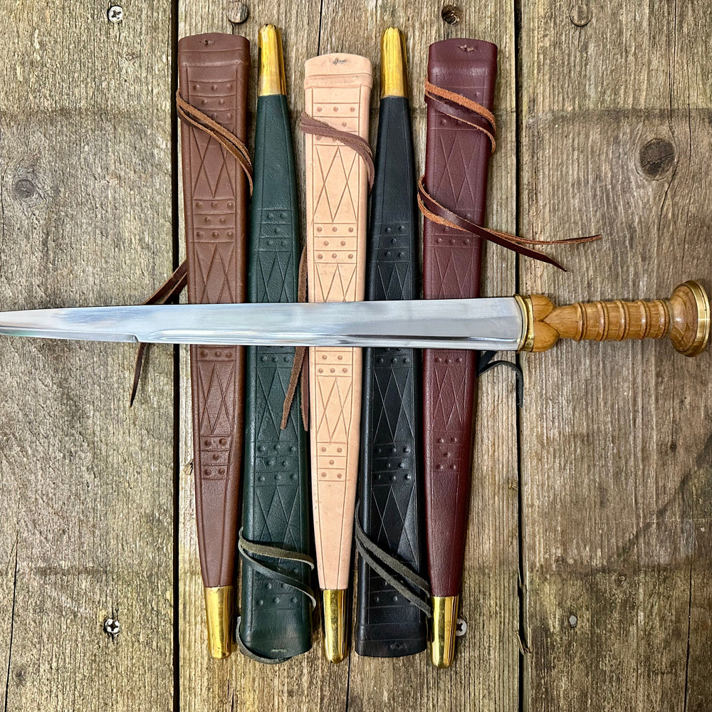 Tod Cutler Scottish Dirk resting on all five colours of scabbard