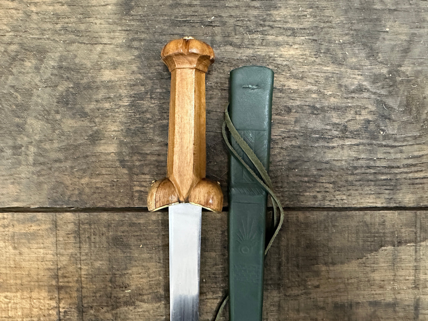 
                  
                    A Mary Rose Bollock Dagger with a green scabbard. 
                  
                