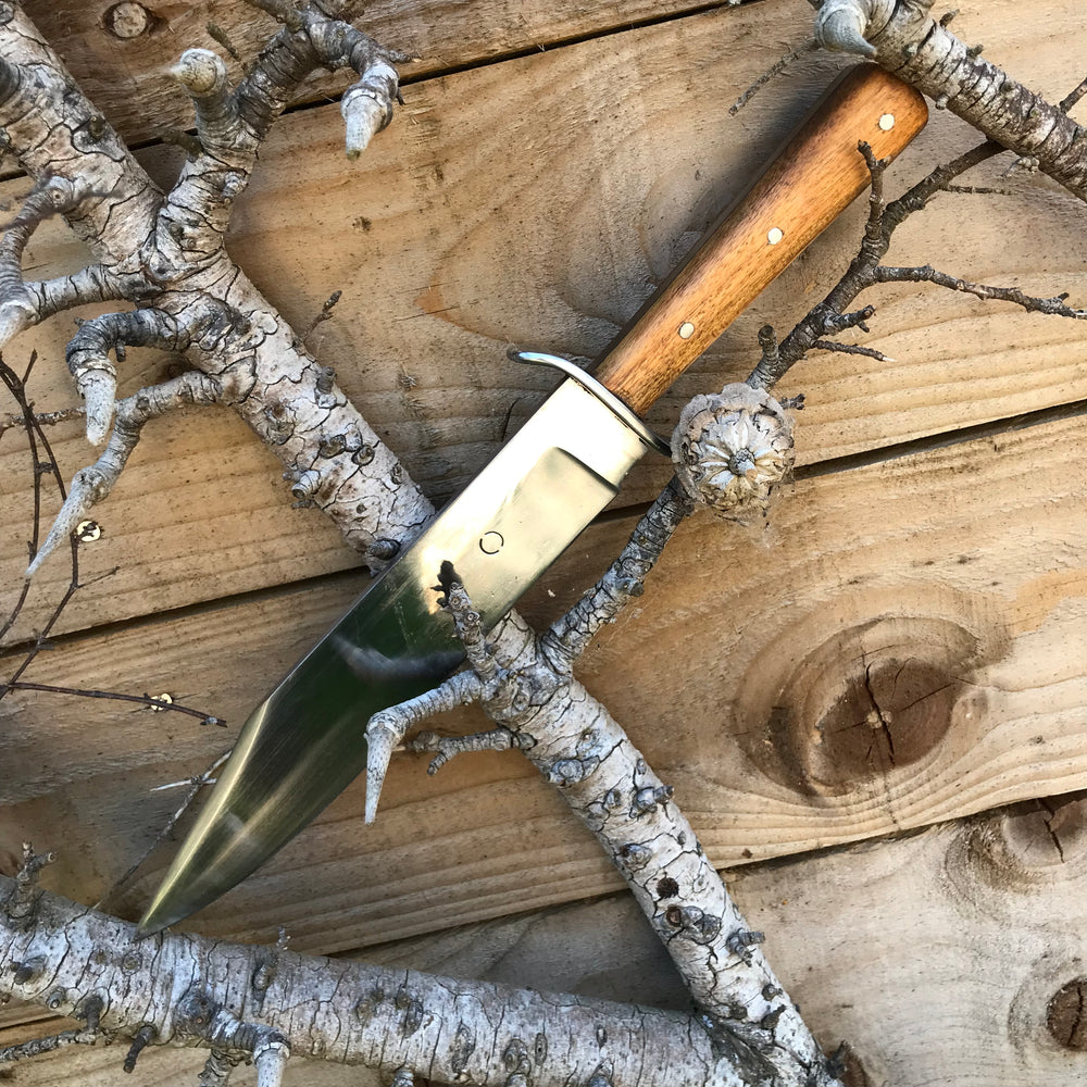 Tod Cutler Bowie knife in a tree 