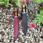 two Tod Cutler Bowie knives in sheathes 
