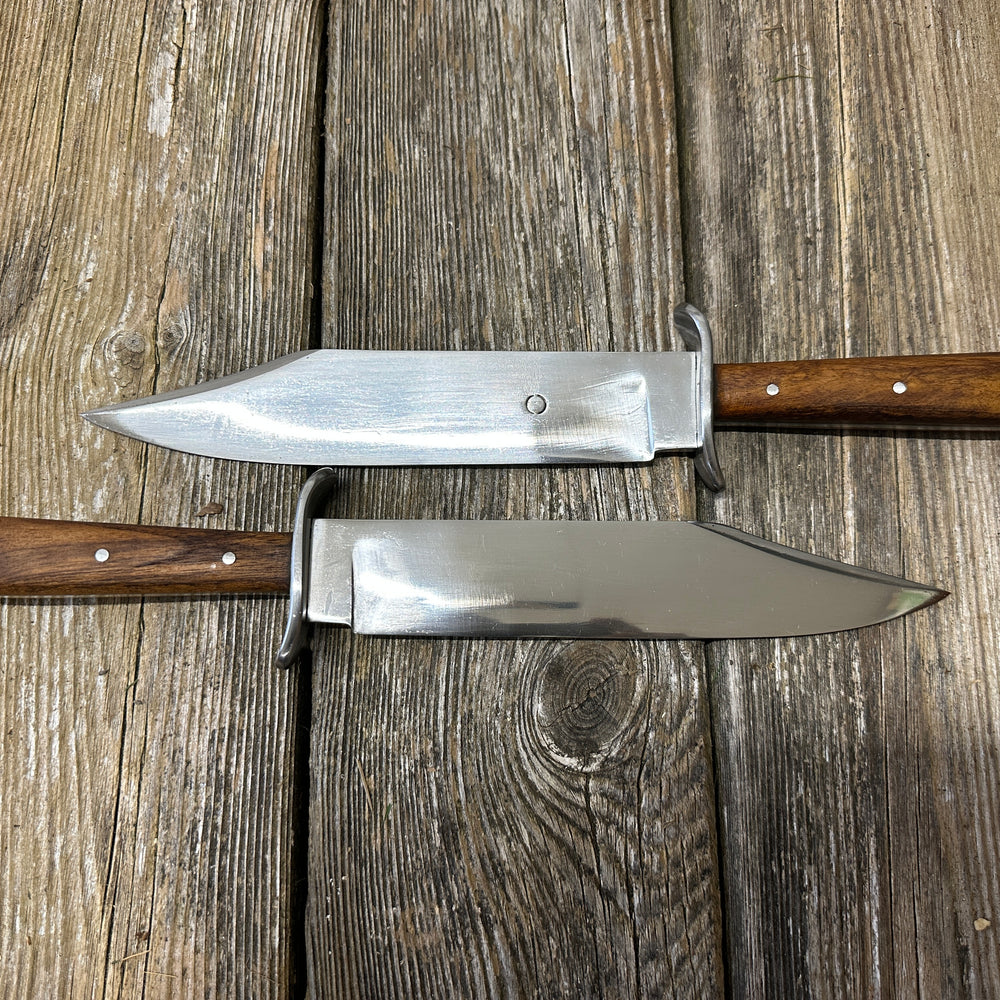 Bowie knives. Two opposing each other. 