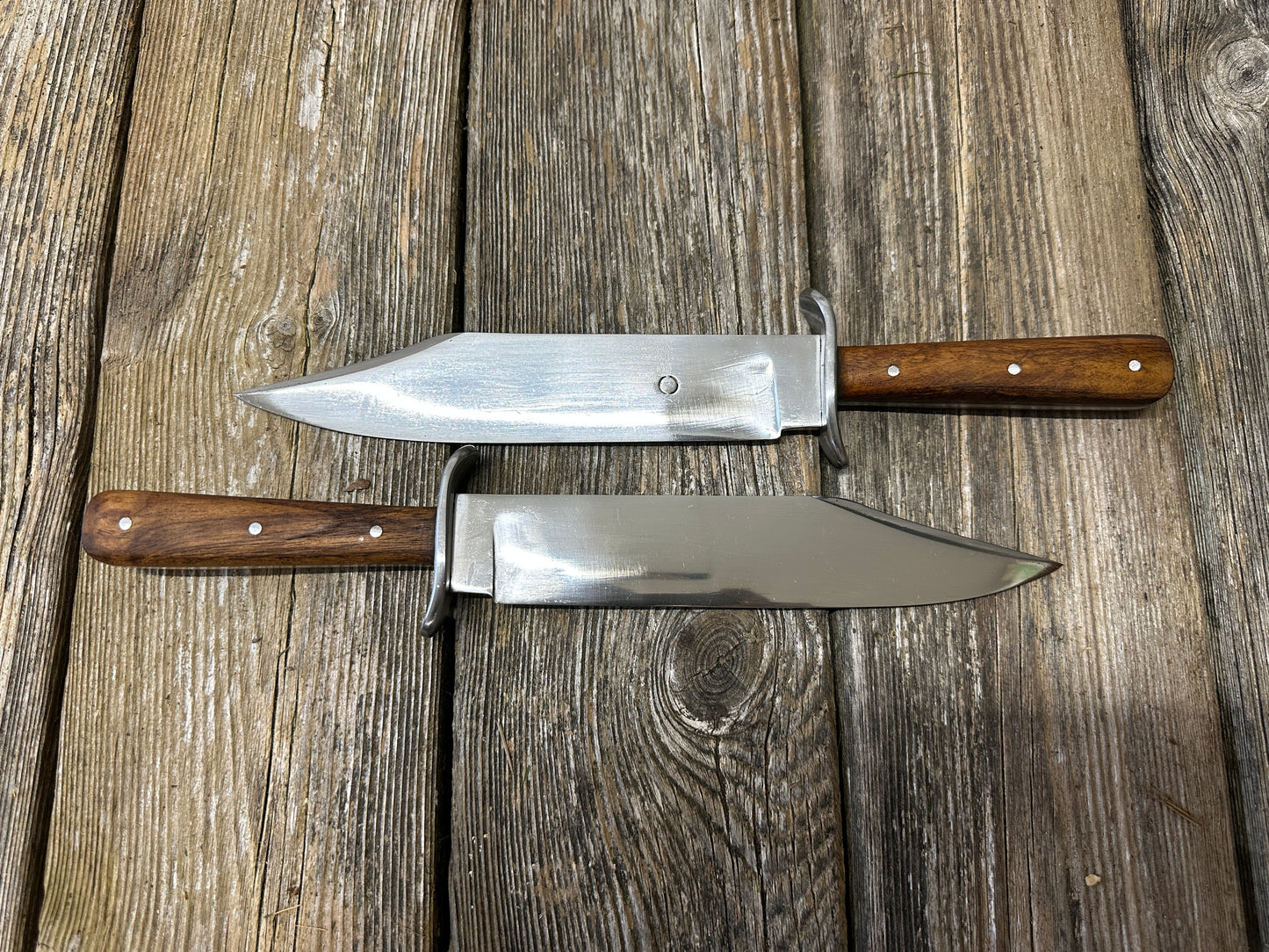 Bowie knives. Two opposing each other. 