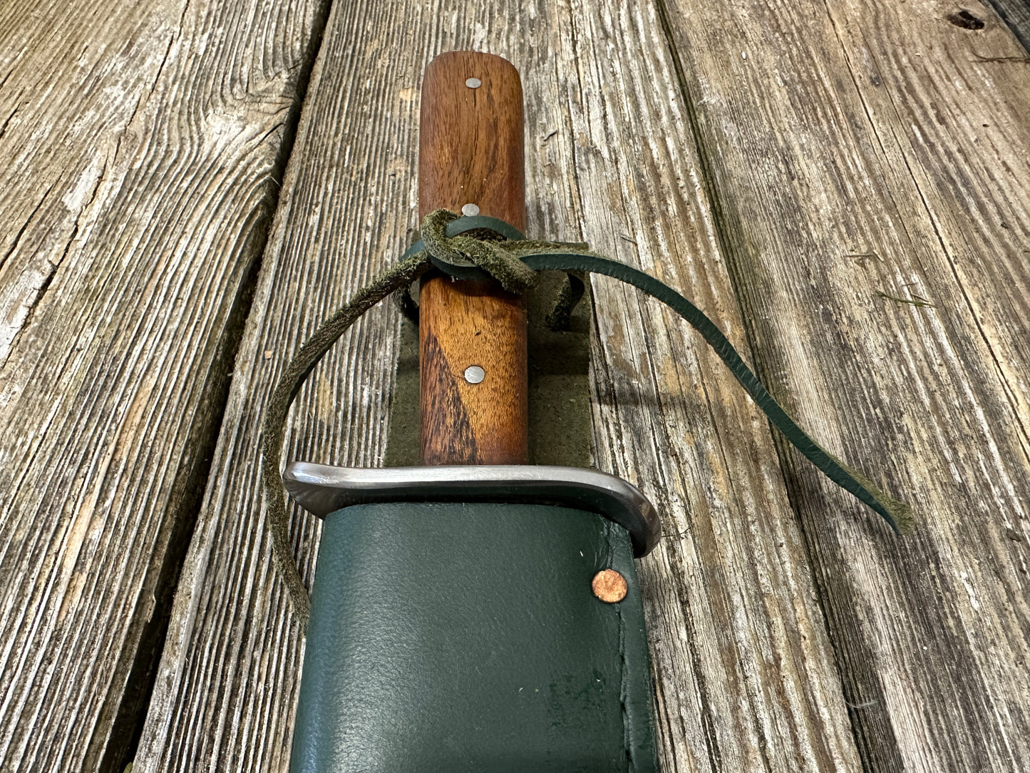 
                  
                    Bowie knife with green scabbard
                  
                