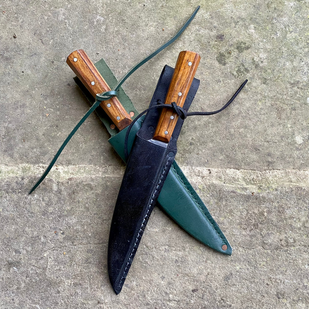 
                  
                    Tod Cutler Sheffield Trade knife on a stone background
                  
                