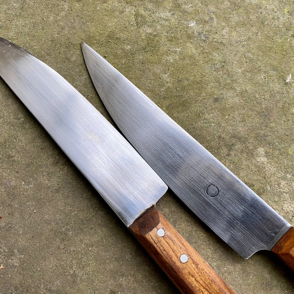 
                  
                    Tod Cutler Sheffield Trade knife on a stone background
                  
                