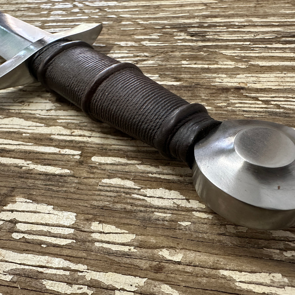
                  
                    14thC Quillon Dagger close up of pommel and hilt

                  
                