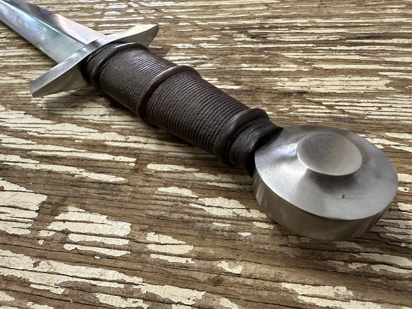 
                  
                    14thC Quillon Dagger close up of pommel and hilt

                  
                