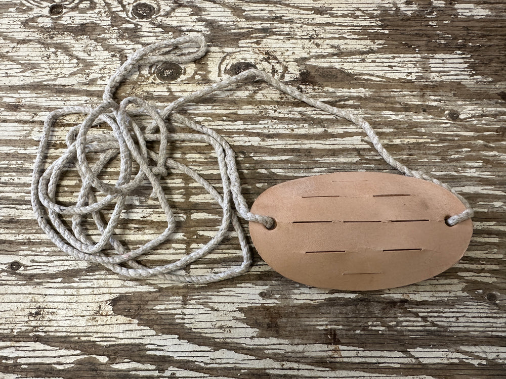 Leather and string make up this sling