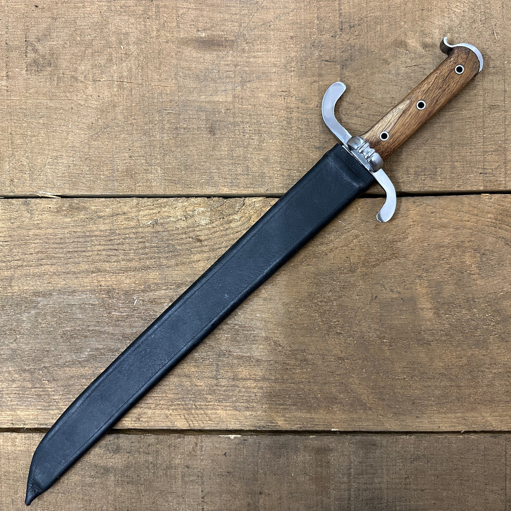 
                  
                    Messer in a black scabbard
                  
                