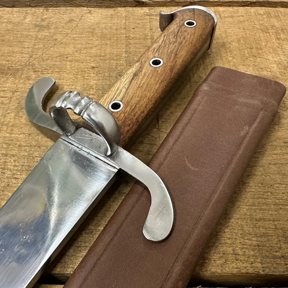 
                  
                    Messer with a brown scabbard
                  
                