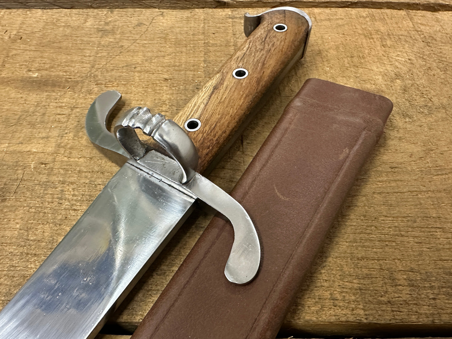 
                  
                    Messer with a brown scabbard
                  
                