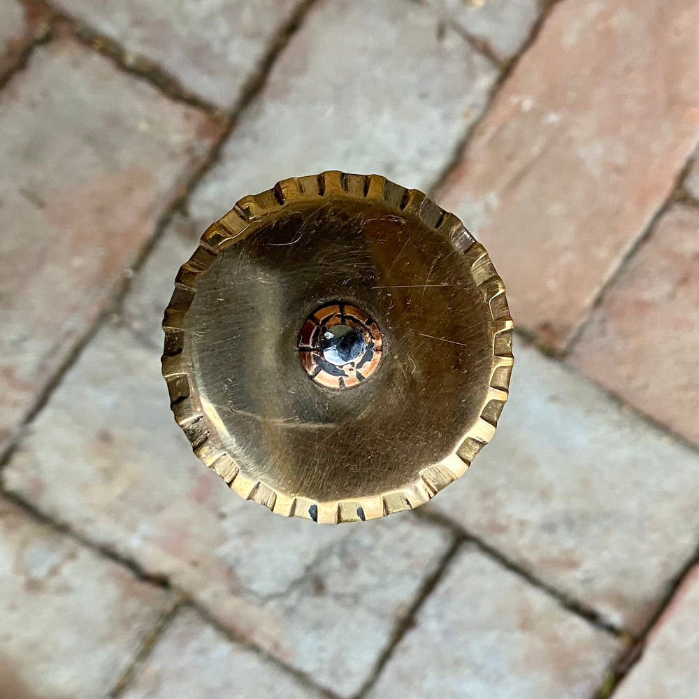 
                  
                    Tod Cutler bronze hilted rondel on a brick background
                  
                