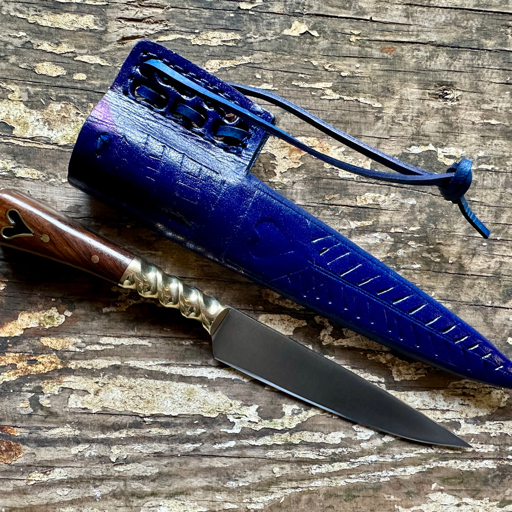 
                  
                    Heart eating knife with a blue sheath
                  
                