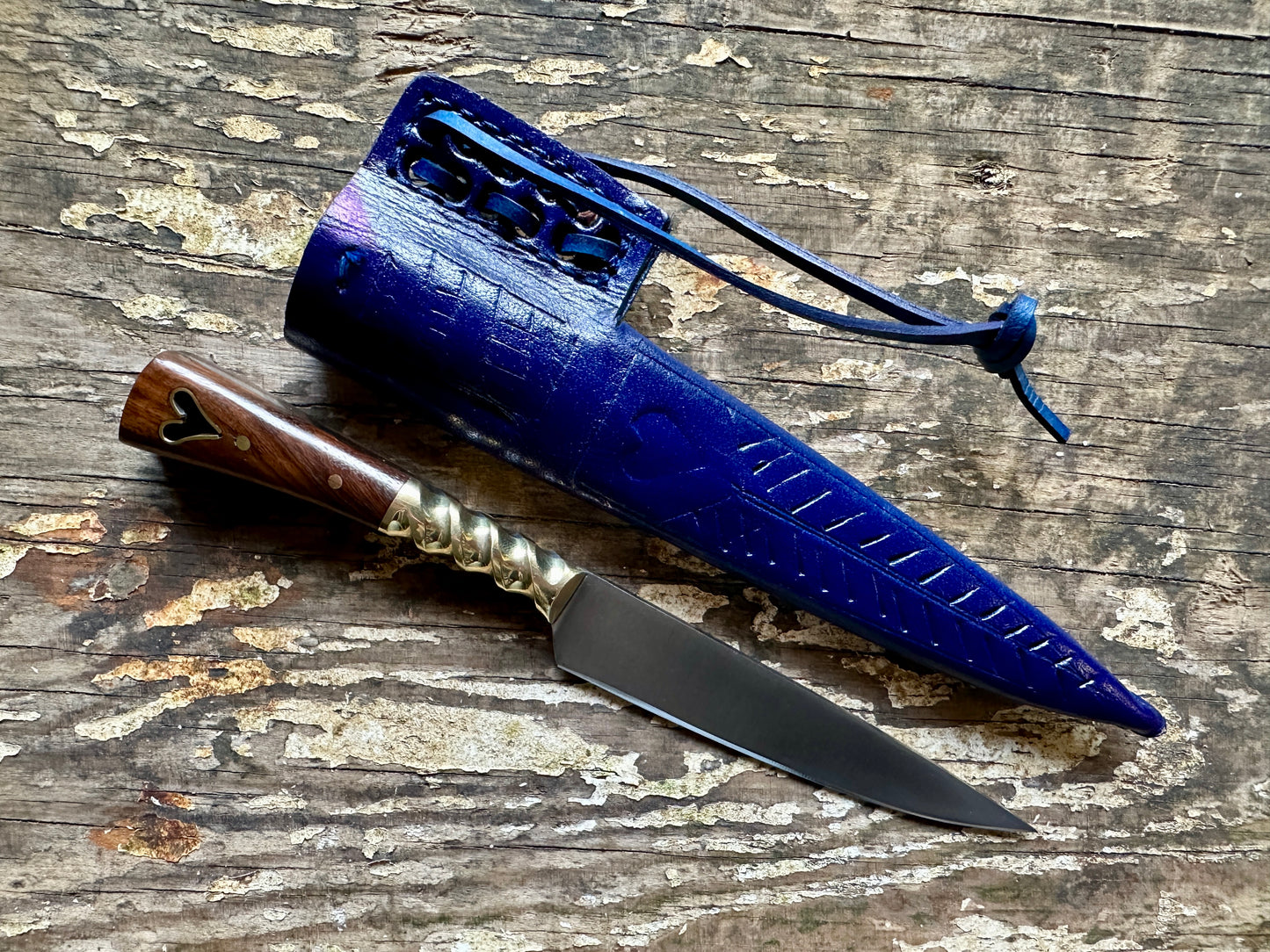 
                  
                    Heart eating knife with a blue sheath
                  
                