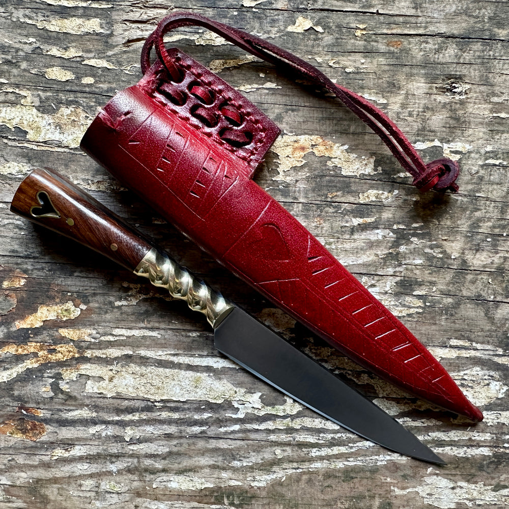 
                  
                    Heart eating knife with a red sheath

                  
                