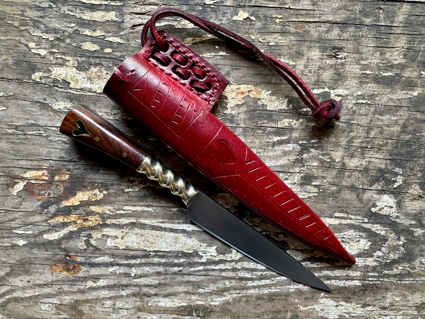 
                  
                    Heart eating knife with a red sheath

                  
                