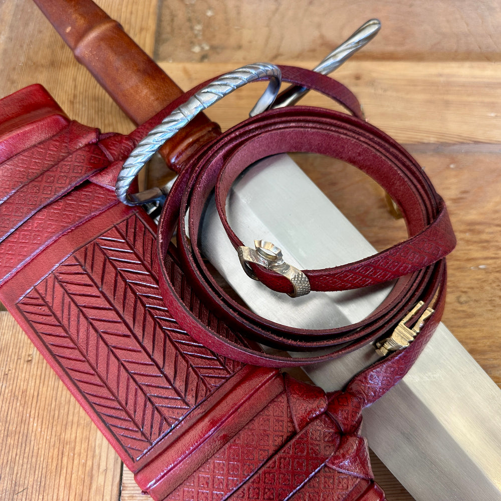
                  
                    German War Sword. With red scabbard
                  
                
