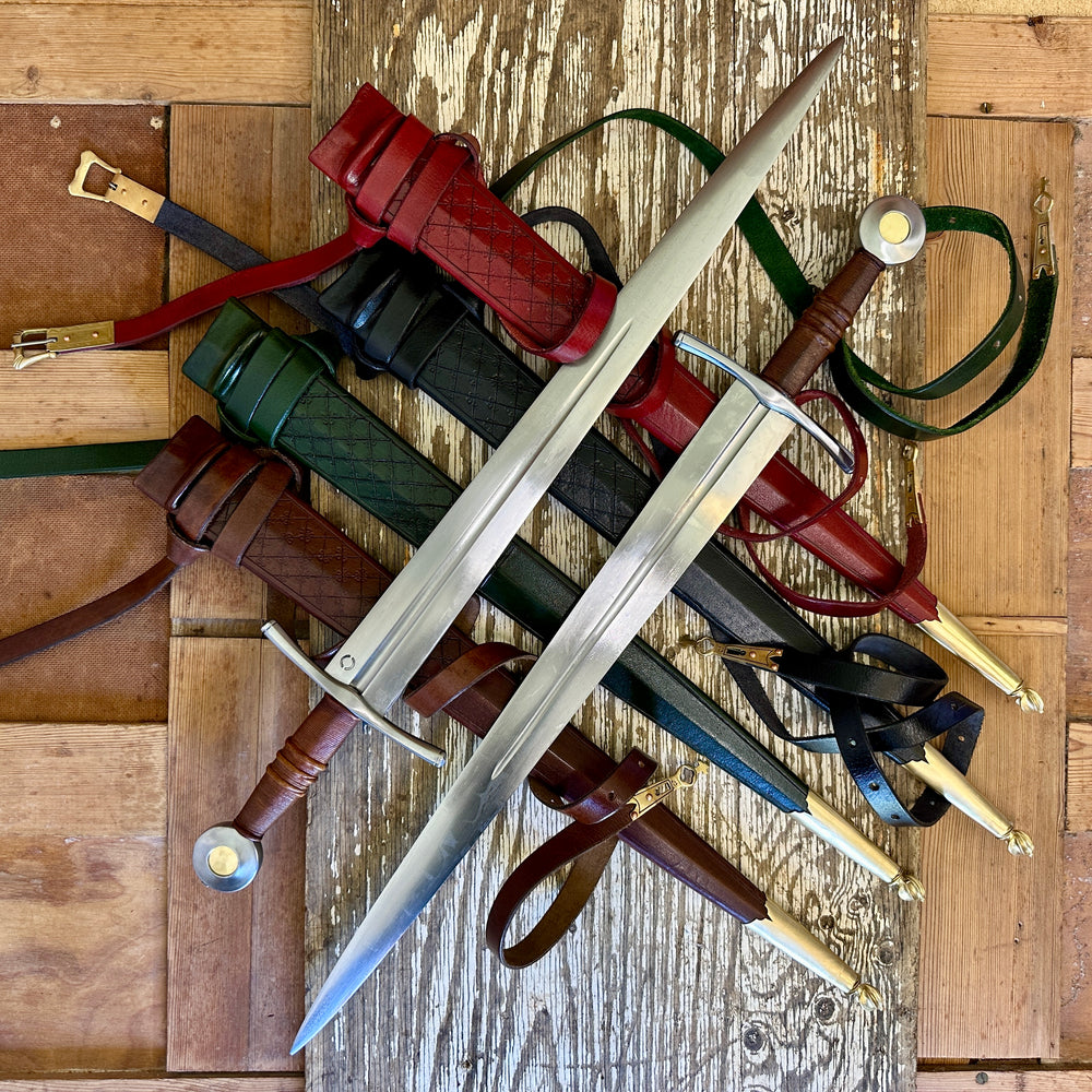 Two swords crossed on a bed of red, black, green and brown scabbards