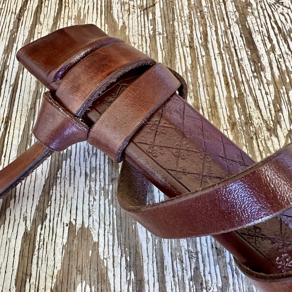 
                  
                    Close up of a brown scabbard
                  
                
