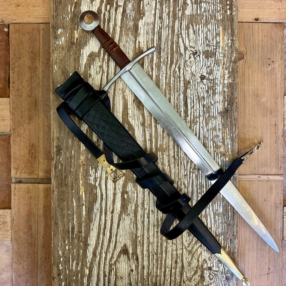 
                  
                    Coustille sword with a black scabbard
                  
                