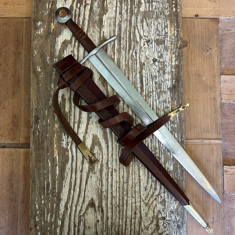 
                  
                    Coustille sword with a brown scabbard
                  
                