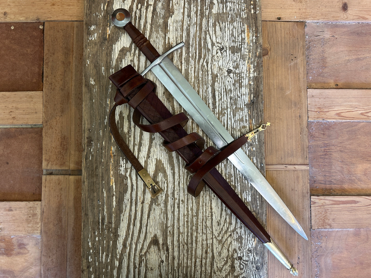 
                  
                    Coustille sword with a brown scabbard
                  
                