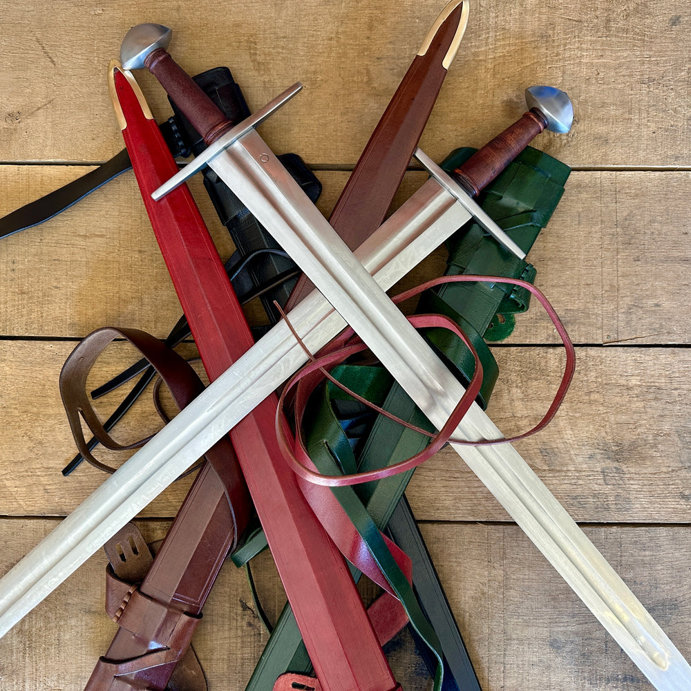 
                  
                    Viking Norman Brazil Nut Swords on a pile of scabbards
                  
                