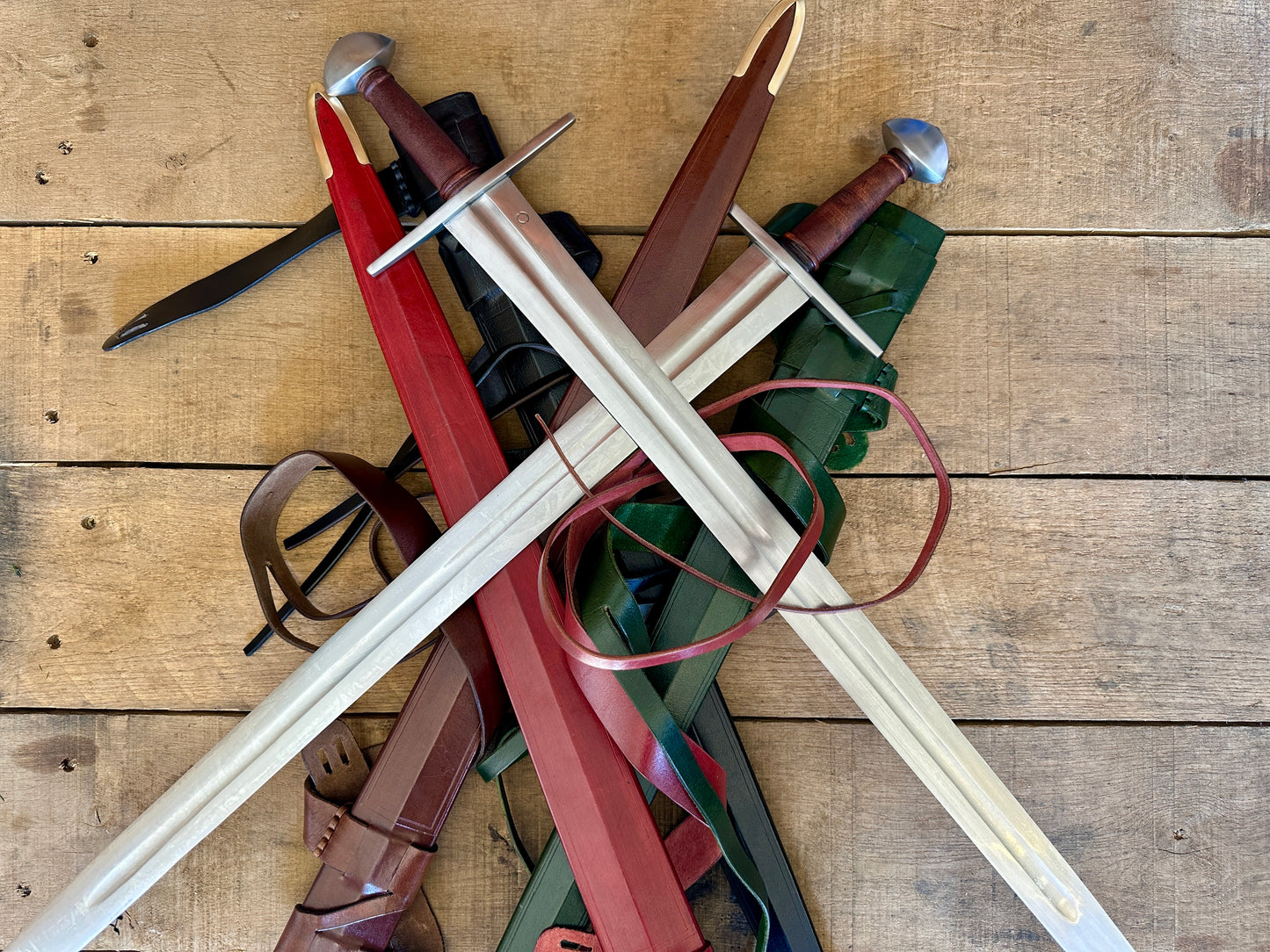 
                  
                    Viking Norman Brazil Nut Swords on a pile of scabbards
                  
                