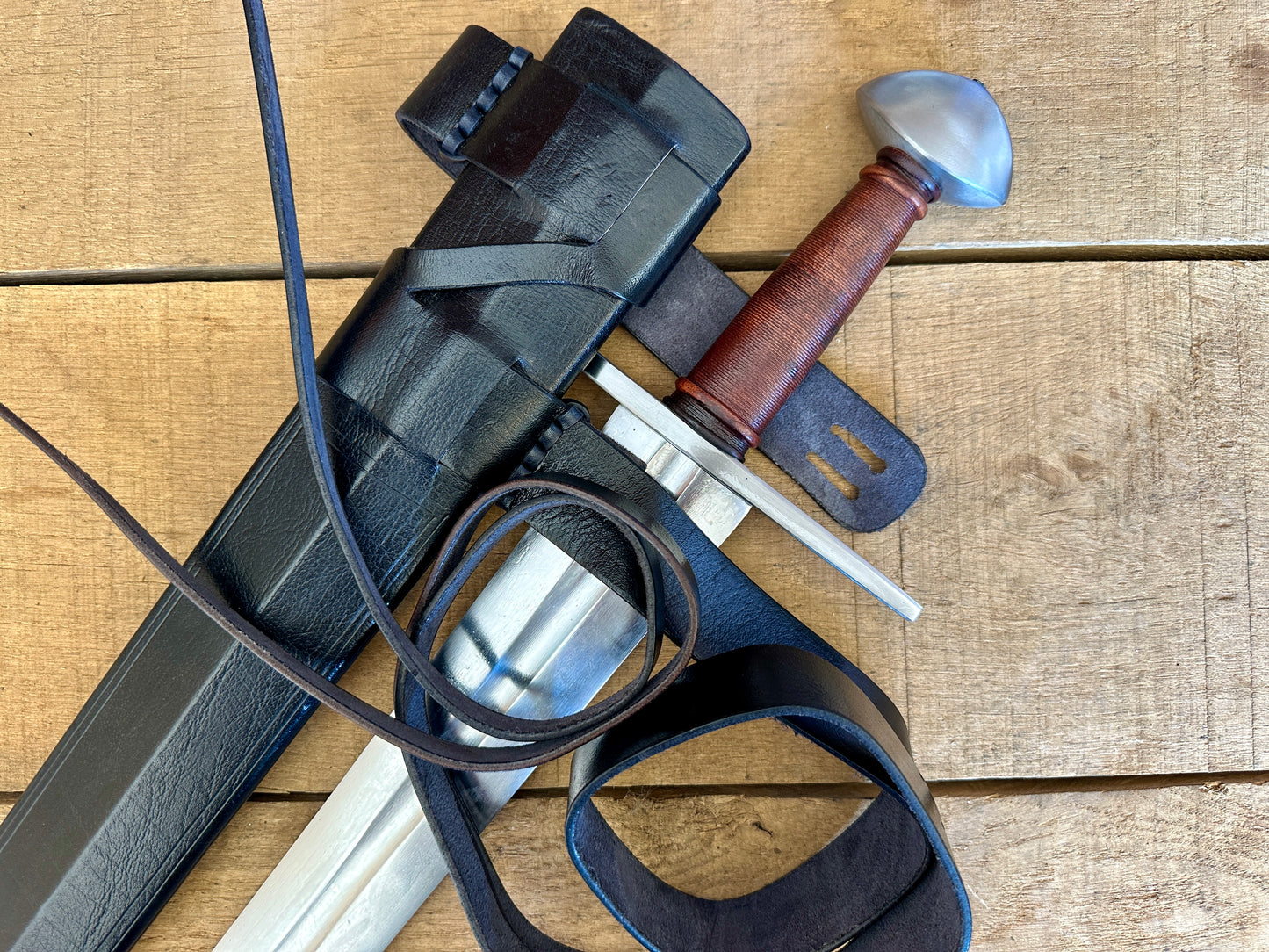 
                  
                    Viking Norman Brazil Nut Sword with a black scabbard 
                  
                