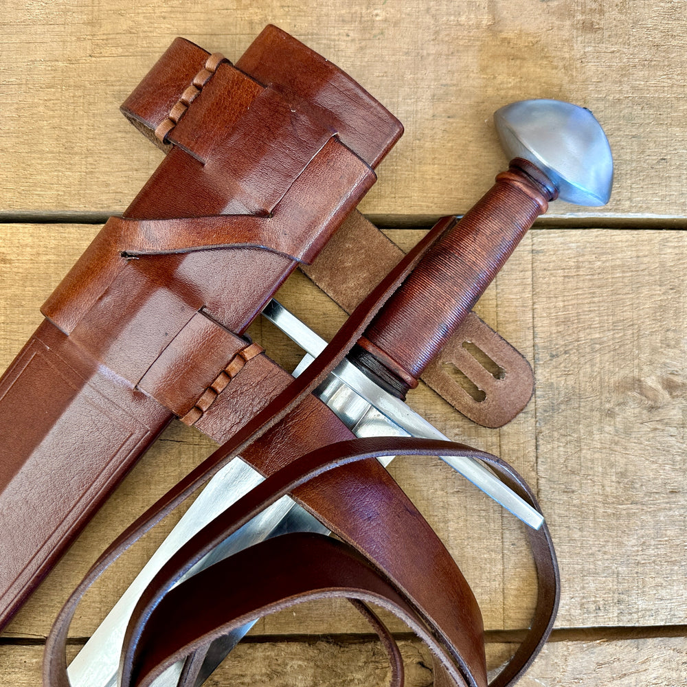 
                  
                    Viking Norman Brazil Nut Sword with a brown scabbard
                  
                