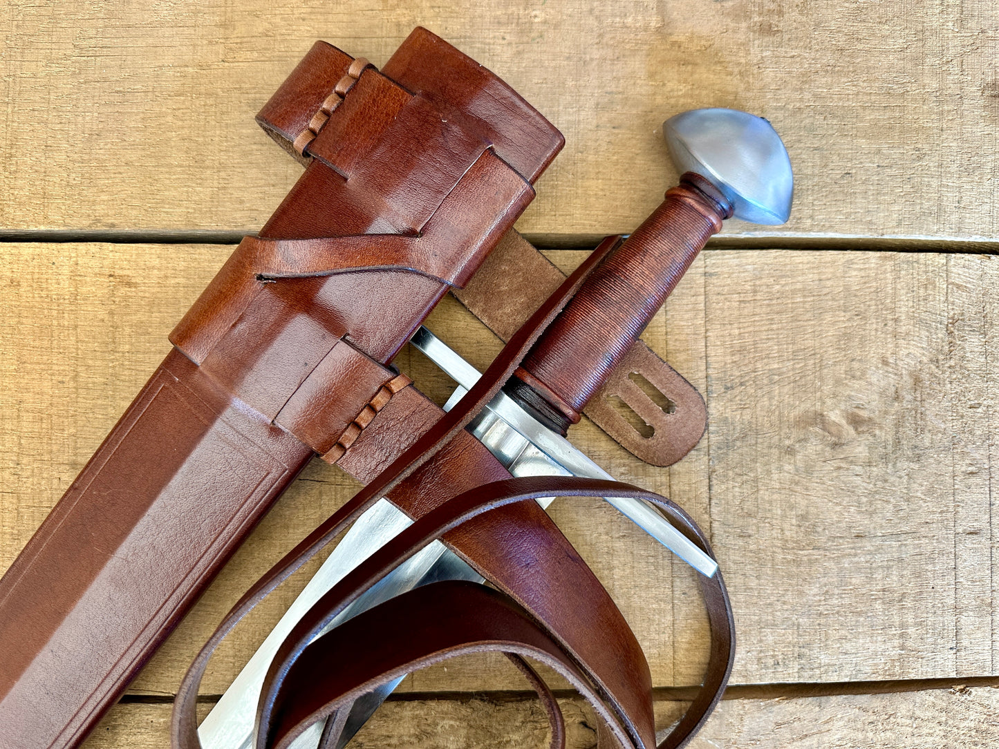 
                  
                    Viking Norman Brazil Nut Sword with a brown scabbard
                  
                
