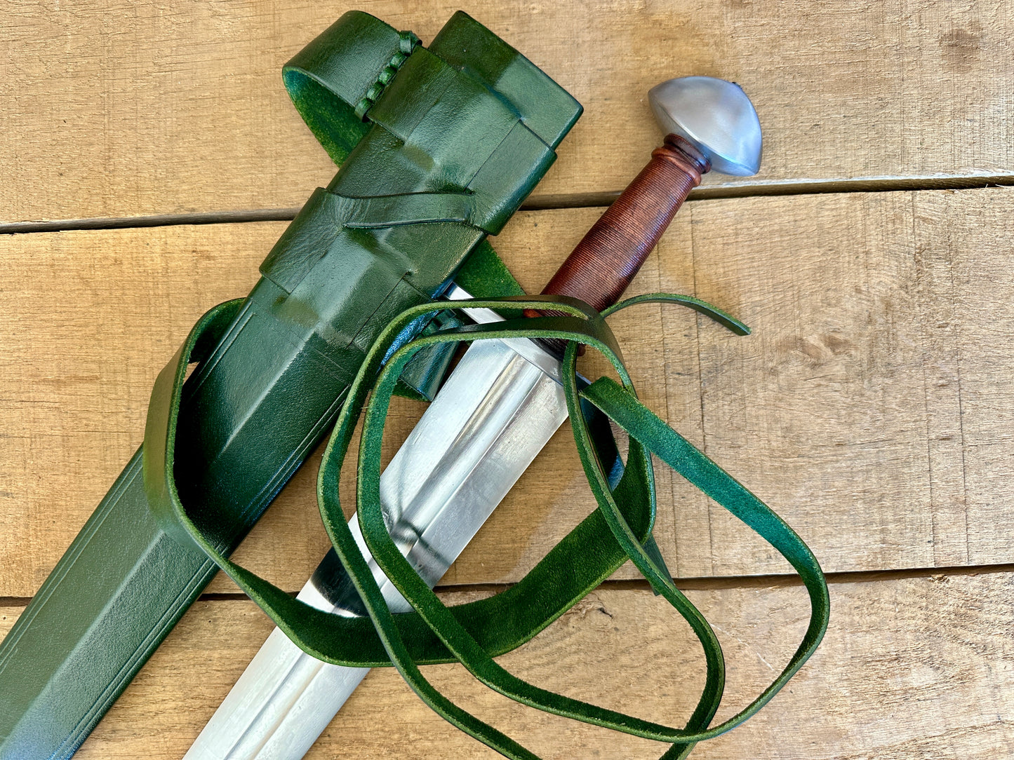 
                  
                    Viking Norman Brazil Nut Sword with a green scabbard 
                  
                