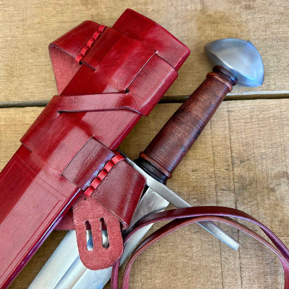 
                  
                    Viking Norman Brazil Nut Sword with a red scabbard 
                  
                