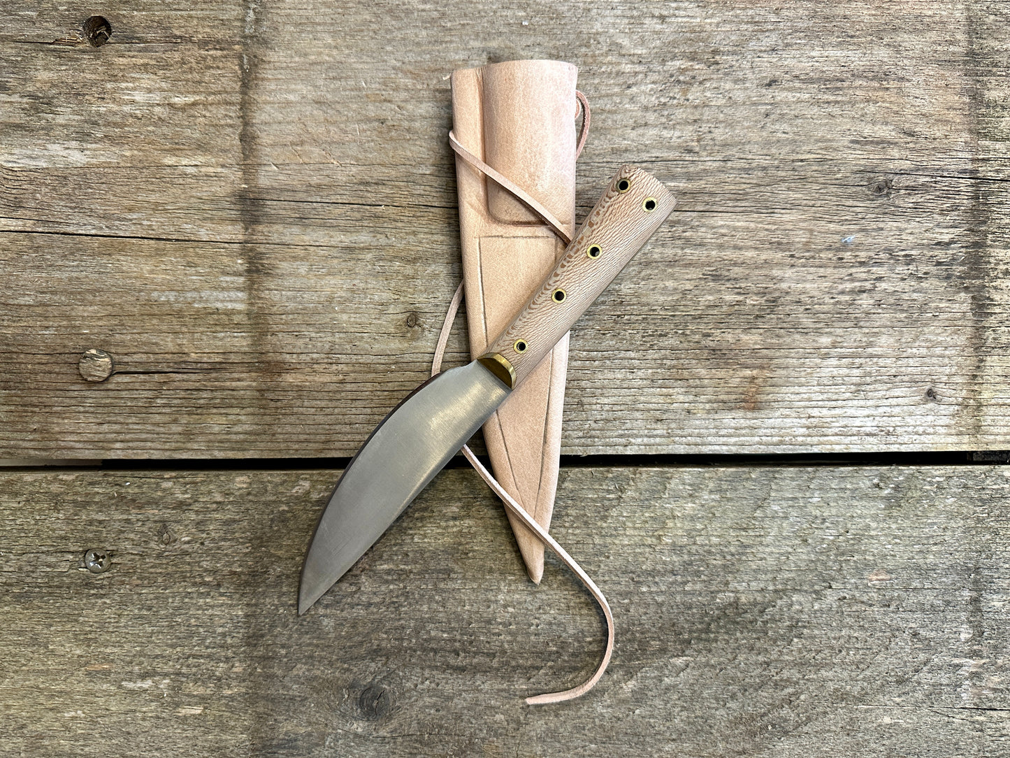 Small cooks knife on natural leather scabbard